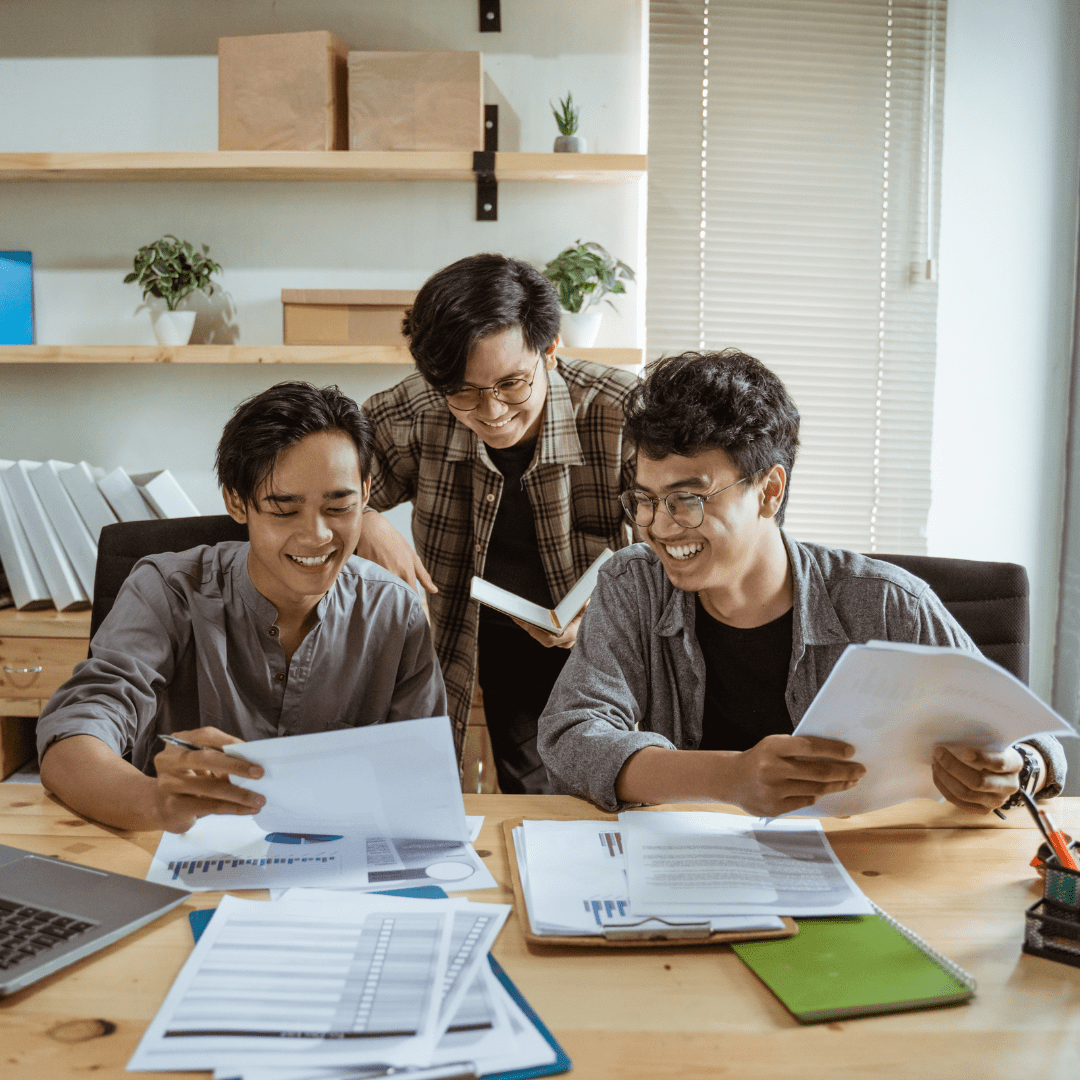 Smiling Small Business Owner Pays Staff